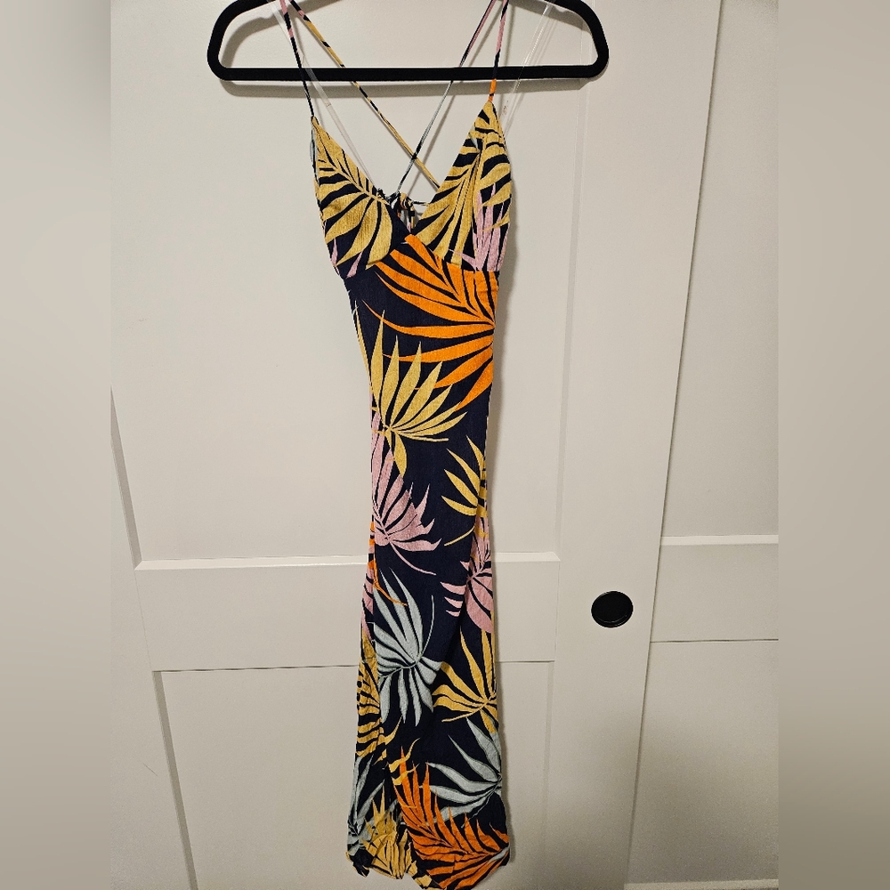 Navy blue maxi dress featuring a tropical palm floral print in yellow